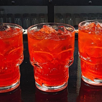 Cocktails served in skull glasses at The Dragon's Den