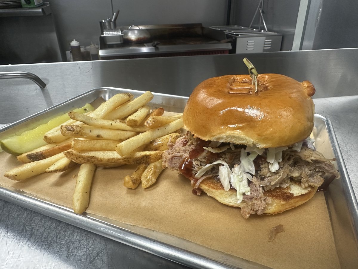 A tavern burger with fries