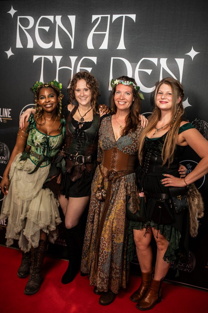 Four friends in flower crowns and bodices on the red carpet